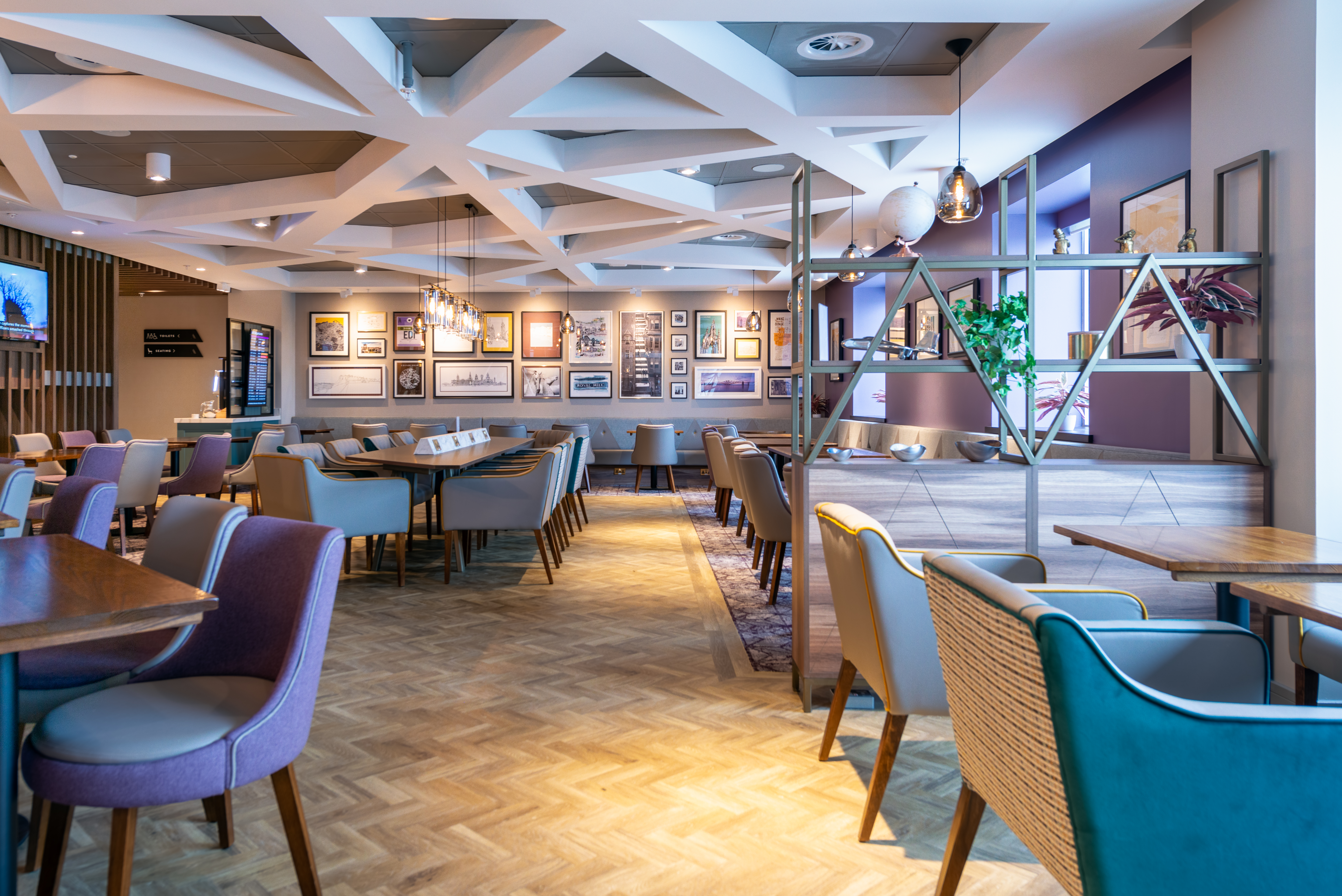 Variety of comfortable seating options available at Edinburgh Gate 16 Aspire Lounge