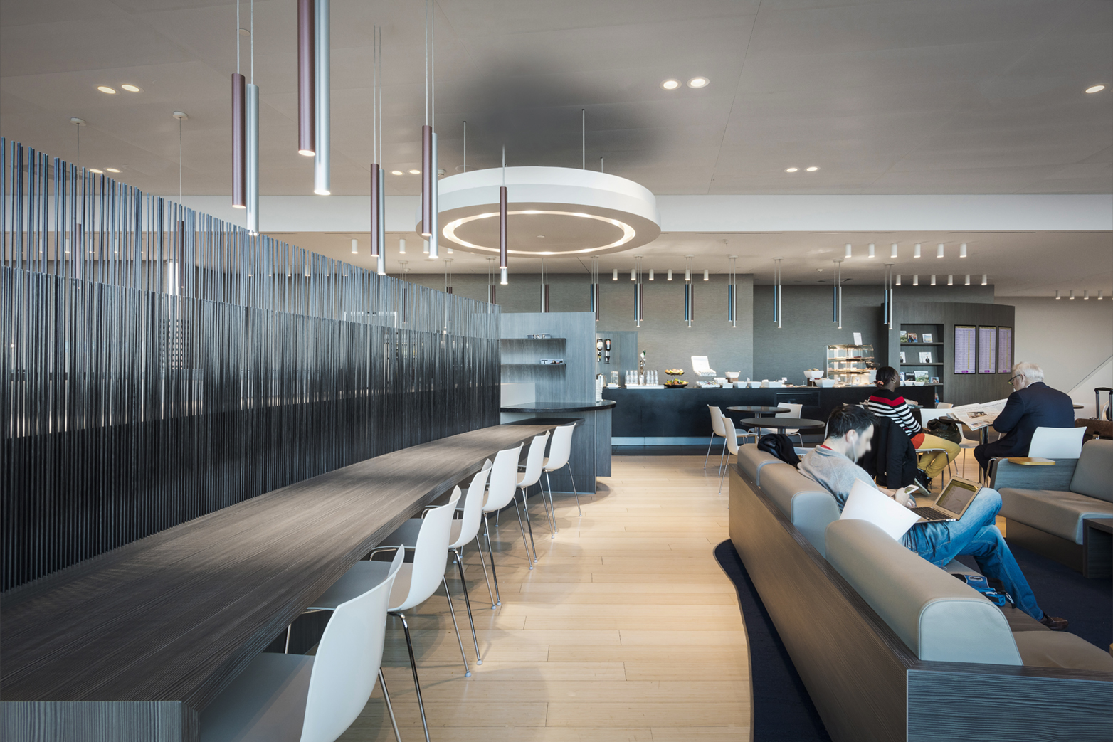 Row of chairs at Amsterdam Gate 26 Aspire Lounge.