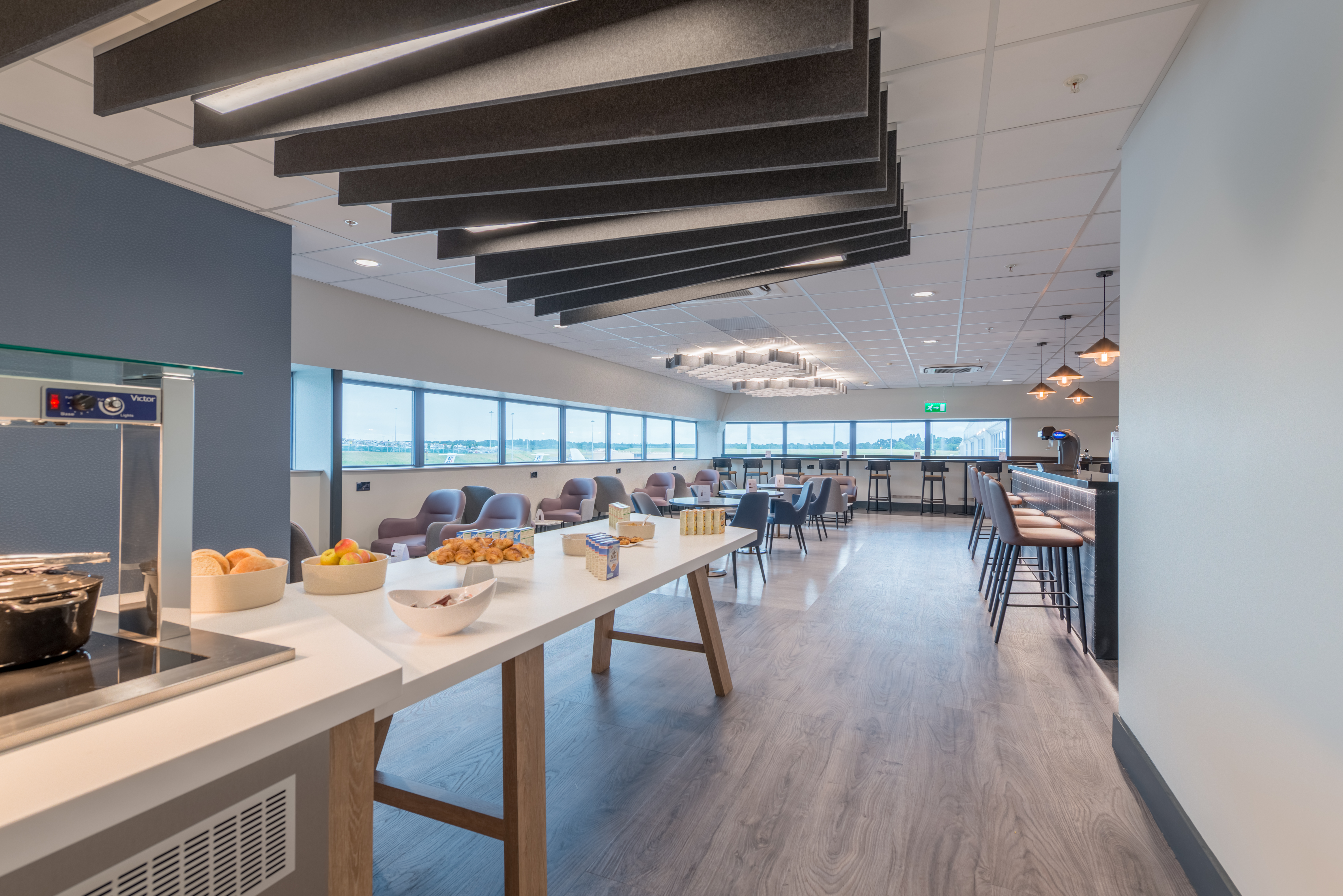 Self service buffet table with a selection of delicious complimentary food options at Birmingham South Aspire Lounge.