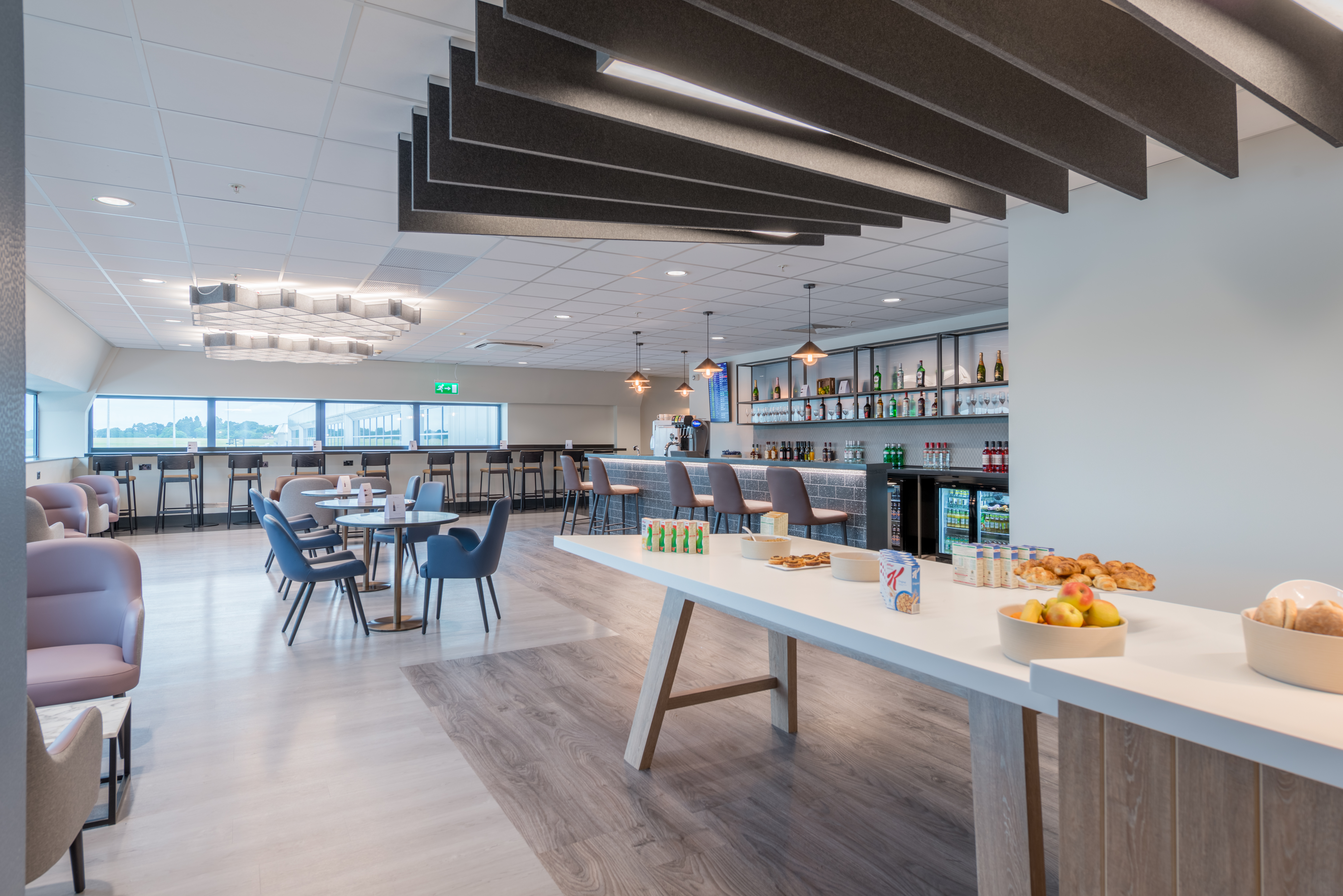 Variety of seating options in an open plan seating area at Birmingham South Aspire Lounge.